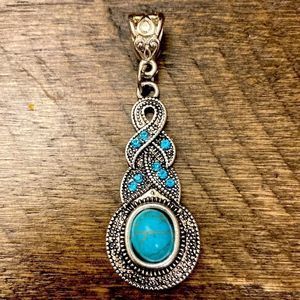 5/$25 Faux silver and turquoise pendant.